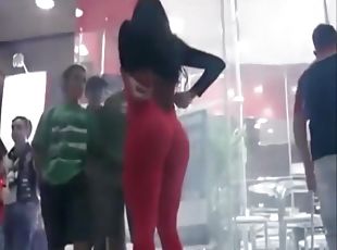 Hot model in tight red suit mingles with the crowd at the club
