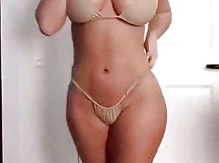 Pretty brunette girl in stunning micro bikini