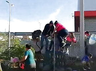 OOPS WOMAN TRAPPED IN FENCE DURING RIOTS