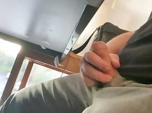 Boss plays with his cock under the desk