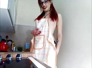 Pale redhead fantises in the kitchen