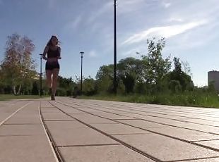 SFW. A girl in a sexy suit is engaged in fitness. Running and squats