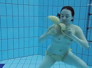 Teen Lada with small tits naked underwater