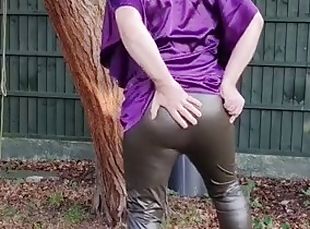 Hot satin hoodie and tight shiny leggings outdoors