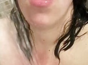 Excited tattooed girl masturbates in the shower and moaning
