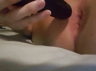 Cute femboy plays with his black dildo