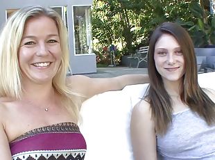 Blonde lesbian MILF fucks younger girl on the couch
