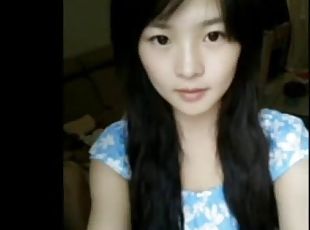 Cute chinese girl playing on webcam