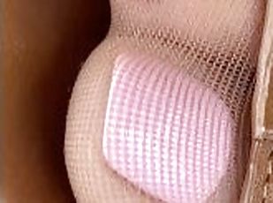 Closeup of wife's crazy cute pantyhose feet and pink toes