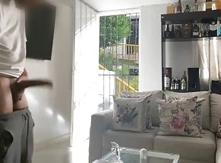 Showing his big cock while the door of his house is open