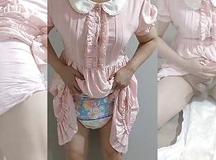 Crossdresser Wearing a Pink Dress and a Think Diaper 03