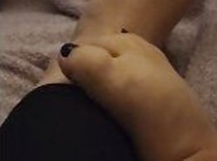 Hot mama's chubby feet playing footsie together